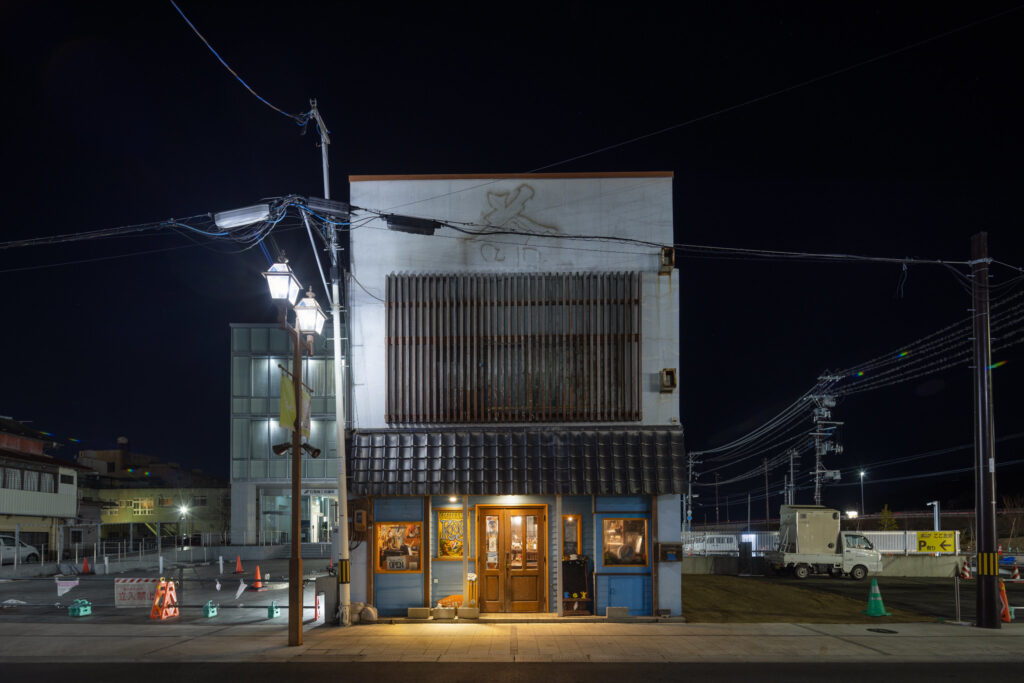 An isolated building as a place of warmth in Ishinomaki, Japan.