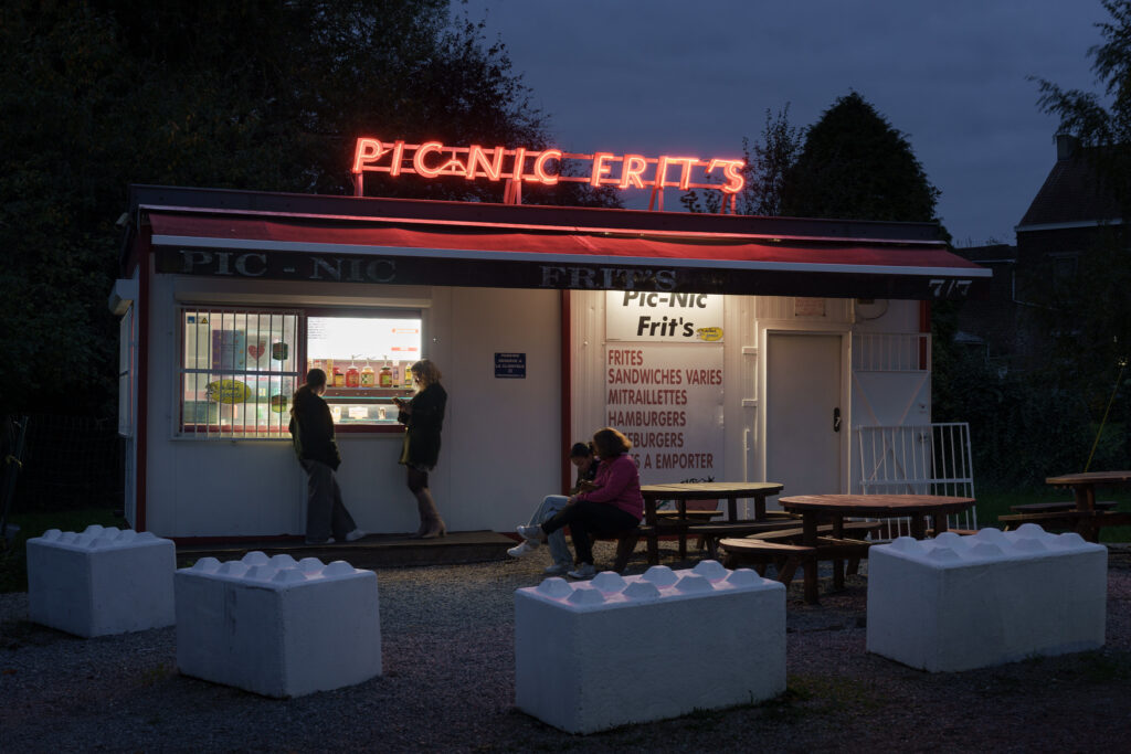 A photograph of a snack shop, Pic-Nic Frit's, at dusk.